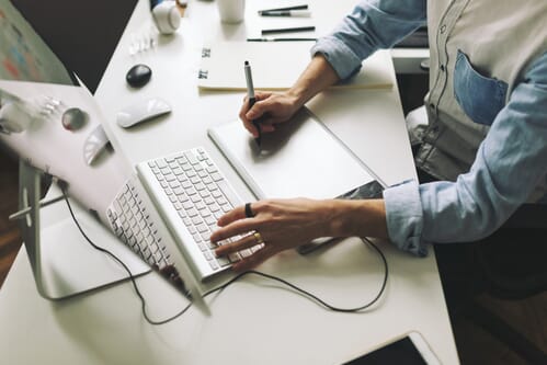 Young graphic designer working in office Picup Media